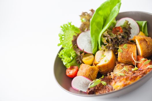 Chicken breast wrapped with vegetables and hash brown in clean food concept