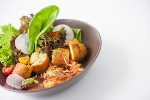 Chicken breast wrapped with vegetables and hash brown in clean food concept