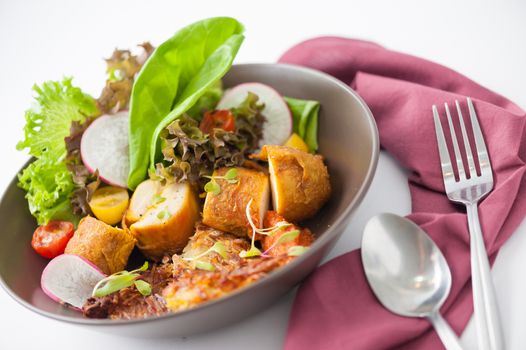 Chicken breast wrapped with vegetables and hash brown in clean food concept