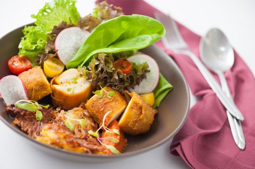 Chicken breast wrapped with vegetables and hash brown in clean food concept