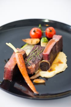 Dry-aged beef steak with mesh potato and vegetable, a modern style food