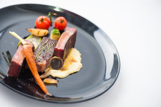 Dry-aged beef steak with mesh potato and vegetable, a modern style food