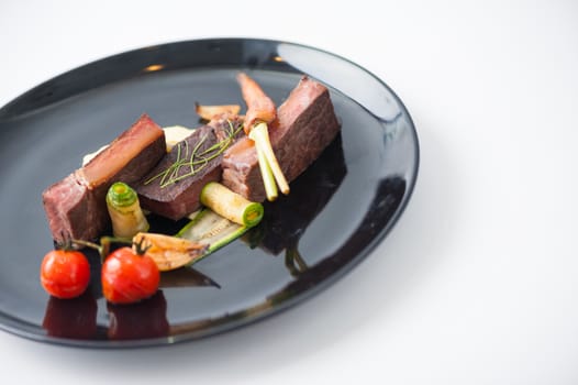 Dry-aged beef steak with mesh potato and vegetable, a modern style food