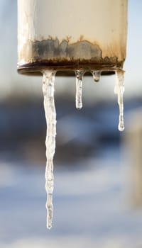 Rainwater Pipe with Icicles close up image.