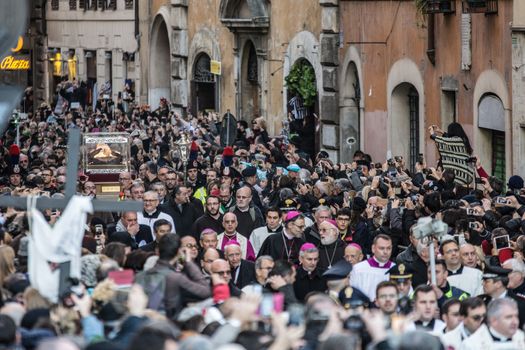 ITALY, Rome: An estimated 20,000 people march in a procession carrying the body of Padre Pio through Rome, Italy on February 5, 2016, as Pope Francis' Extraordinary Jubilee of Mercy continues. The procession honors Padre Pio and St. Leopold Mandic, as their bodies are carried from the church of San Salvatore in Lauro, to St. Peter's Basilica at the Vatican. Padre Pio's body arrived in Rome for the first time this week, where it will remain until next week for a series of Masses, vigils, and events at a number of Roman churches.