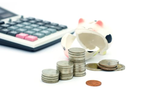 Thai stack coins in financial concept on white background, graph stack coin with accounting calculator and broken piggy bank