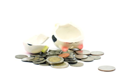 Thai stack coins with broken piggy bank on white background, financial concept photo