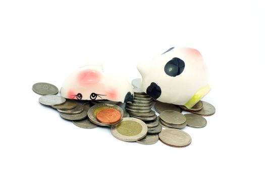 Thai stack coins with broken piggy bank on white background, financial concept photo