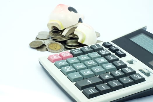 Thai stack coins in financial concept on white background, broken piggy bank put on stack coins