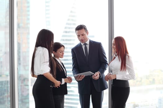 Group of business people using tablet in office