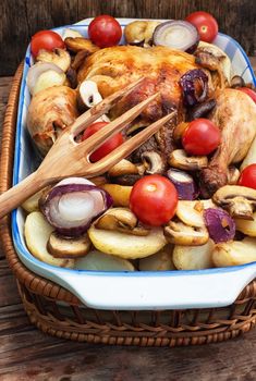 chicken baked to crust in vegetables lined in ceramic form
