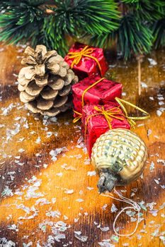 Christmas decoration for decorations on snowy wooden background.Photo tinted.