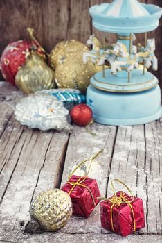 retro Christmas toys on the background of the souvenir carousel with horses