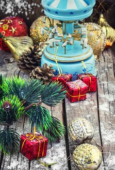retro Christmas toys on the background of the souvenir carousel with horses