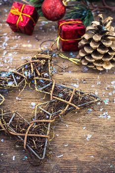 Christmas decoration for decorations on snowy wooden background.Photo tinted.