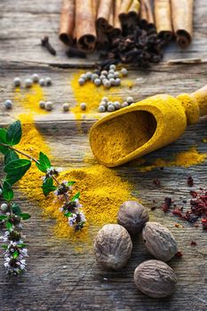 Set of different spices on the old wooden table.Photo rustic