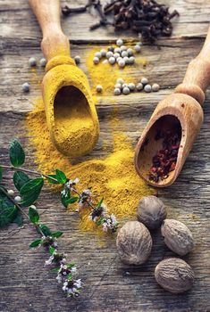 Set of different spices on the old wooden table.Photo rustic