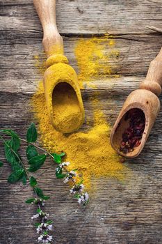 Set of different spices on the old wooden table.Photo rustic