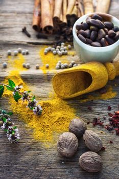 Set of different spices on the old wooden table.Photo rustic