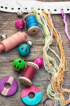 beads and jewelry for handmade on light orange plate