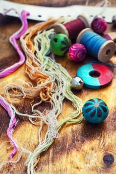 beads and jewelry for handmade on light orange plate