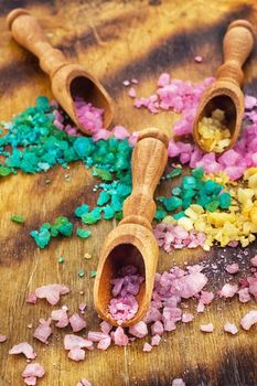 Sea salt for Spa relaxation treatments on the background of wooden scoops