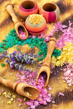 Sea salt for Spa relaxation treatments on the background of wooden scoops
