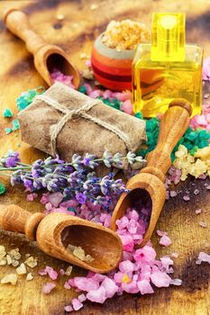 Sea salt for Spa relaxation treatments on the background of wooden scoops