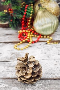 pine cones on the background of snow-covered Christmas ornaments