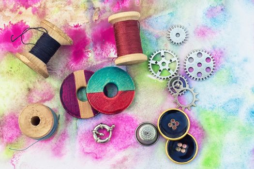 accessories of beads and threads for needlework on wooden plank