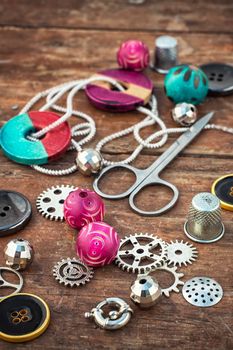 beads and jewelry for handmade on light orange plate