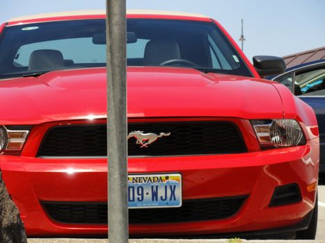 San Francisco, USA - July 22 2010: Ford Mustang GT (2010-2012) parked in a parking lot. Close-up and Front View Red Ford Mustang 2010