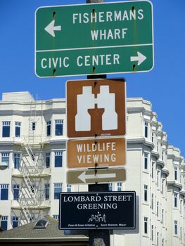 Tourist Signs in the Street of San Francisco. Signs indicate the Best Place to visit in San Francisco: Fisherman's Wharf, Lombard Street, Civic Center...          