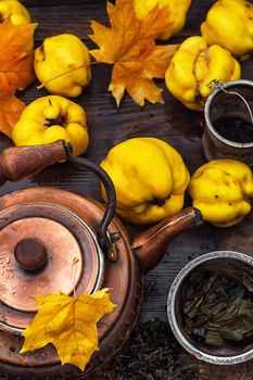 Copper kettle brewing and quinces in an old stylish derevna box