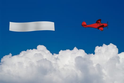 Red plane pulls blank banner over white clouds