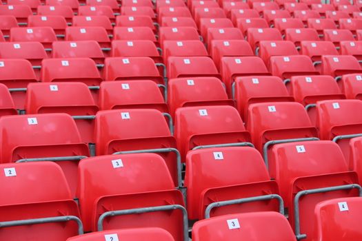 Empty red seats in stadium