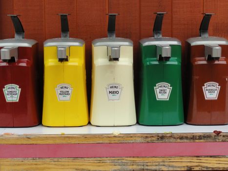 Big Sur, USA - July 24 2010: Heinz Condiments Dispenser Pack in a Fast Food Restaurant. Heinz is an American Food Company