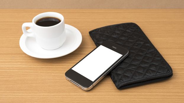 coffee cup and phone and wallet on wood table