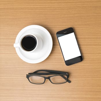 coffee cup and phone and eyeglasses on wood background