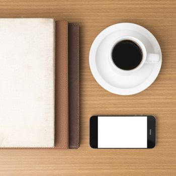 coffee cup and phone and stack of book on wood background