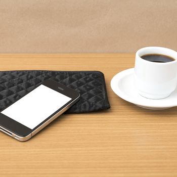coffee cup and phone and wallet on wood table