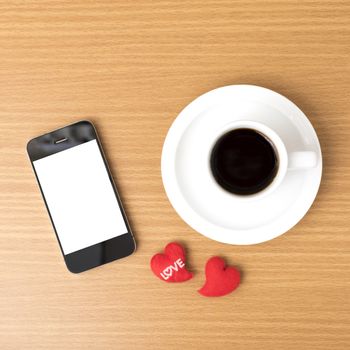 coffee cup and phone and heart on wood background