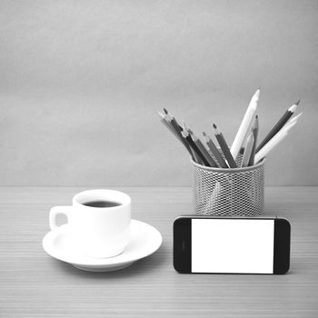 coffee cup and phone with color pencil on wood background black and white color