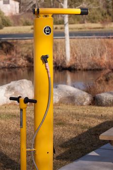 bicycle do it yourself repair station on the side of the trail