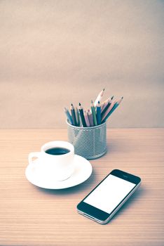 coffee cup and phone with color pencil on wood background vintage style