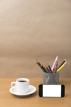 coffee cup and phone with color pencil on wood background