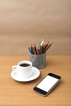 coffee cup and phone with color pencil on wood background