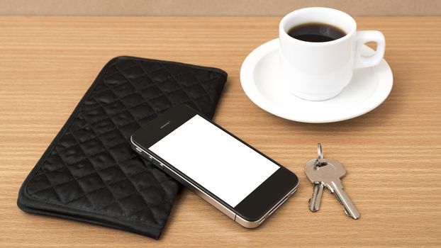 coffee phone key and wallet on wood table background