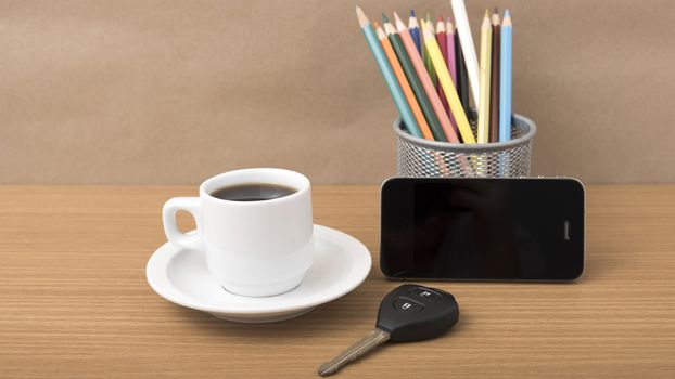 coffee,phone,car key and heart on wood table background