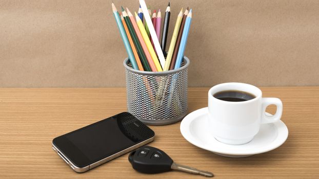 coffee,phone,car key and heart on wood table background